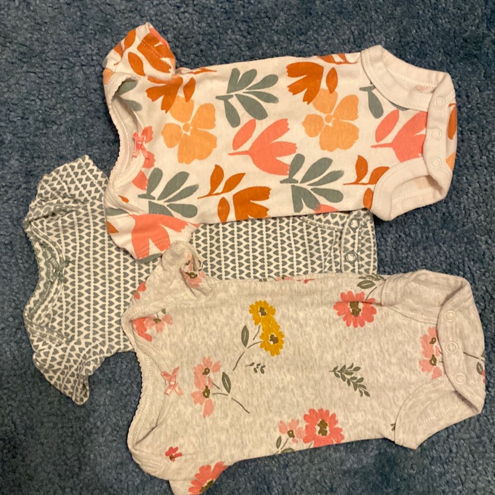 Carters size preemie. Three pack short sleeve button onesies.